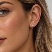 a lab-grown diamond stud earrings worn on earlobe