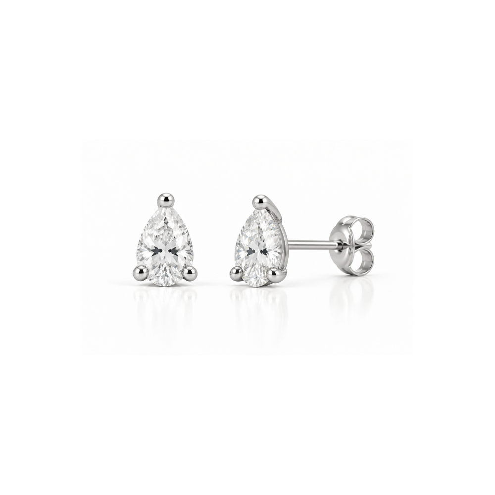 a 14k white gold pear shape diamond studs in a white background.