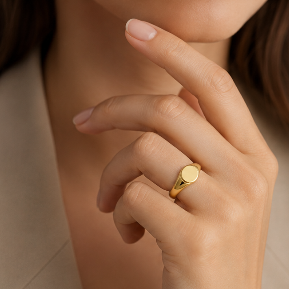 oval signet ring worn on hand