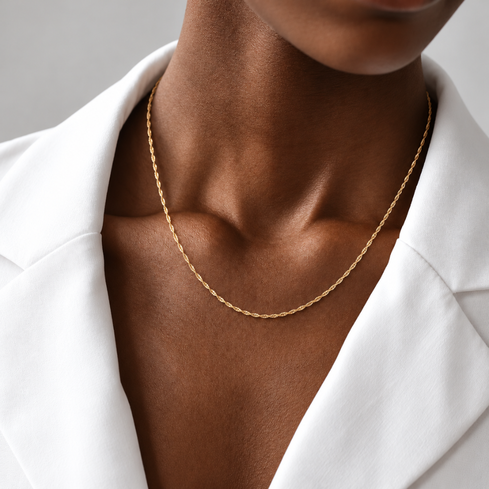 18-inch 10k yellow gold singapore chain necklace worn by a female model