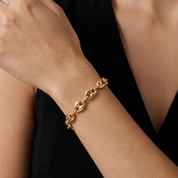 Woman wearing gold Puffy Anchor Bracelet with 8mm links