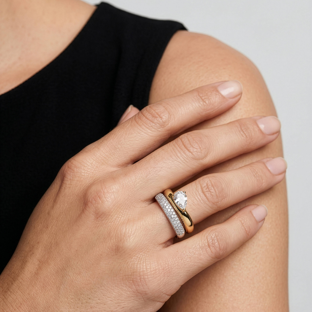 Two-Tone Pear CZ Stacking Rings worn on hand