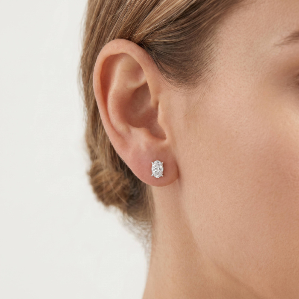 Woman wearing Oval Cut Lab Diamond Studs