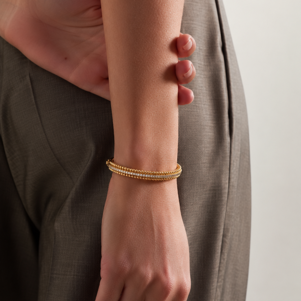 Woman wearing gold Cubic Zirconia Beaded Bangle with pavé stones