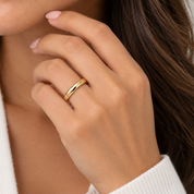 female model wearing plain 4mm wedding band in 10k yellow gold
