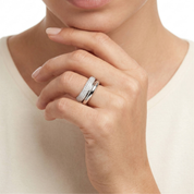 Pavé and polished wave rings styled on finger