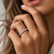 close up of a 14k white gold lab-grown diamonds eternity sytle band worn on hands