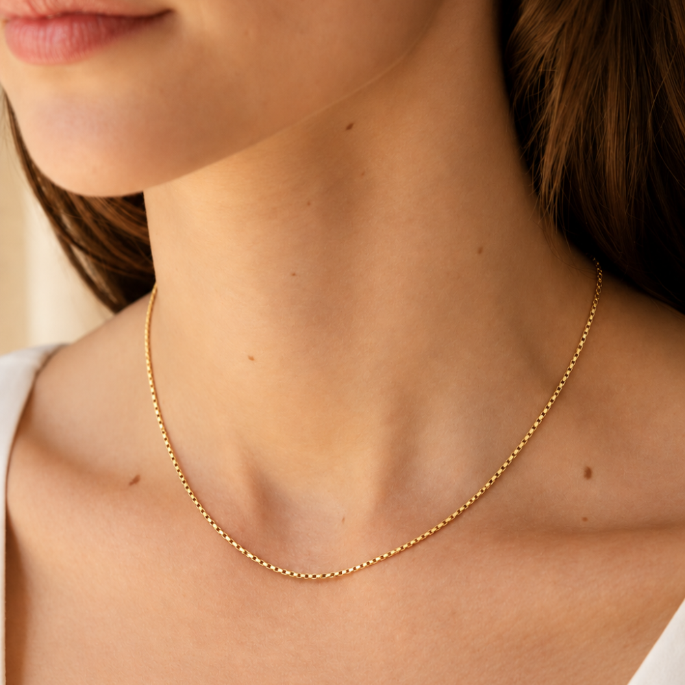 16-inch 10k yellow gold semi-solid box chain necklace worn by a female model