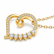 A yellow gold heart-shaped pendant necklace with pavé-set clear stones along the curved edges and a row of seven round clear stones across the bottom, shown on a white background with part of the chain visible.