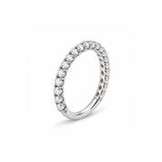 A 14k white gold diamond eternity style ring on a white background.