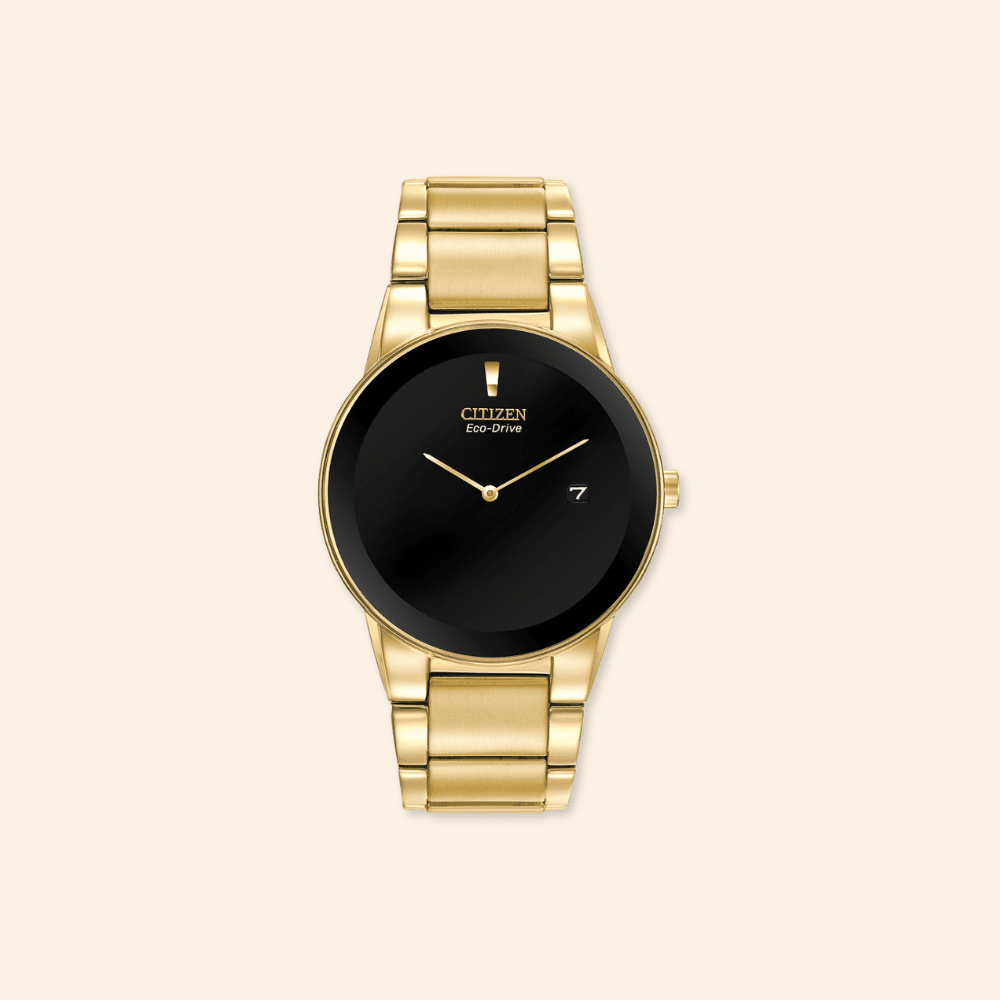 Citizen watch eco-drive with black face on a beige background