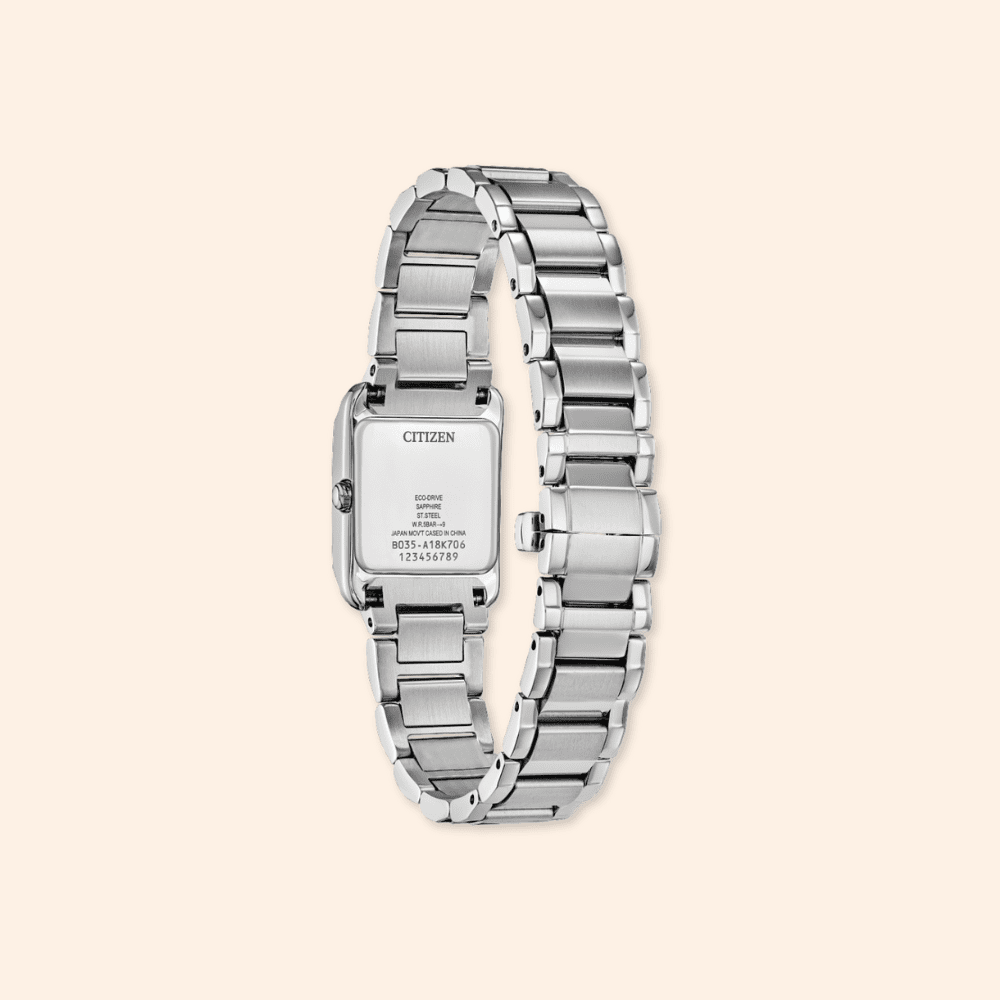 Silver Citizen watch on a beige background