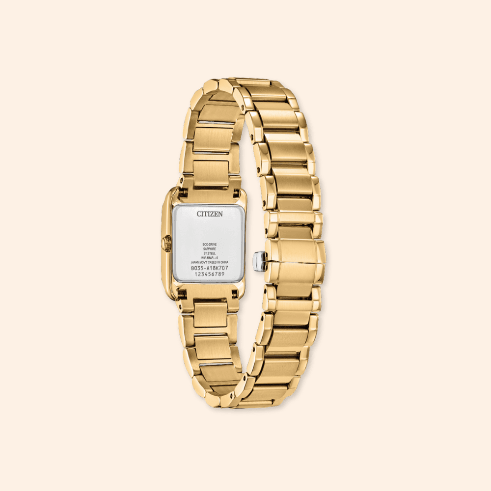 back of a citizen eco-drive yellow steel watch