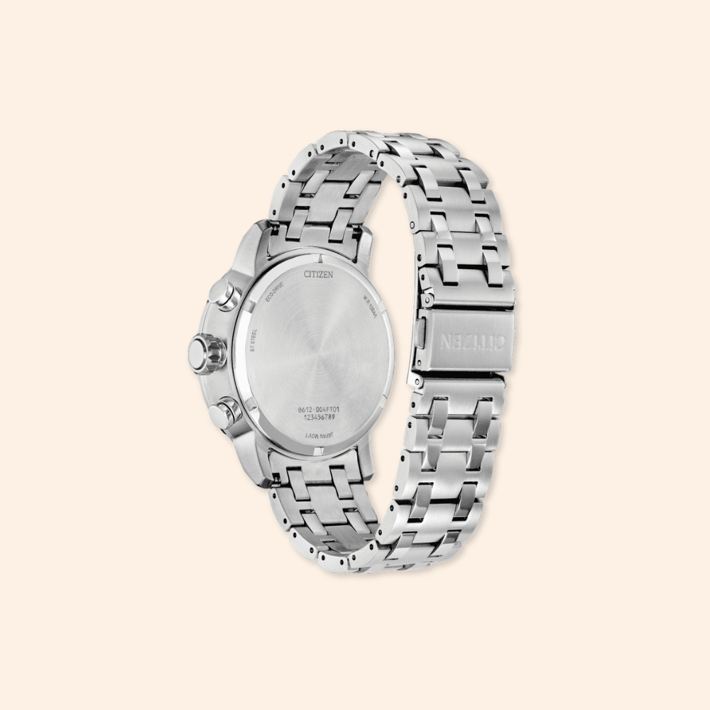 Silver citizen watch with a detailed metal band on a light beige background