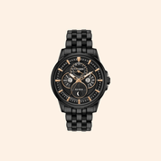 Black Citizen watch with detailed face on a beige background