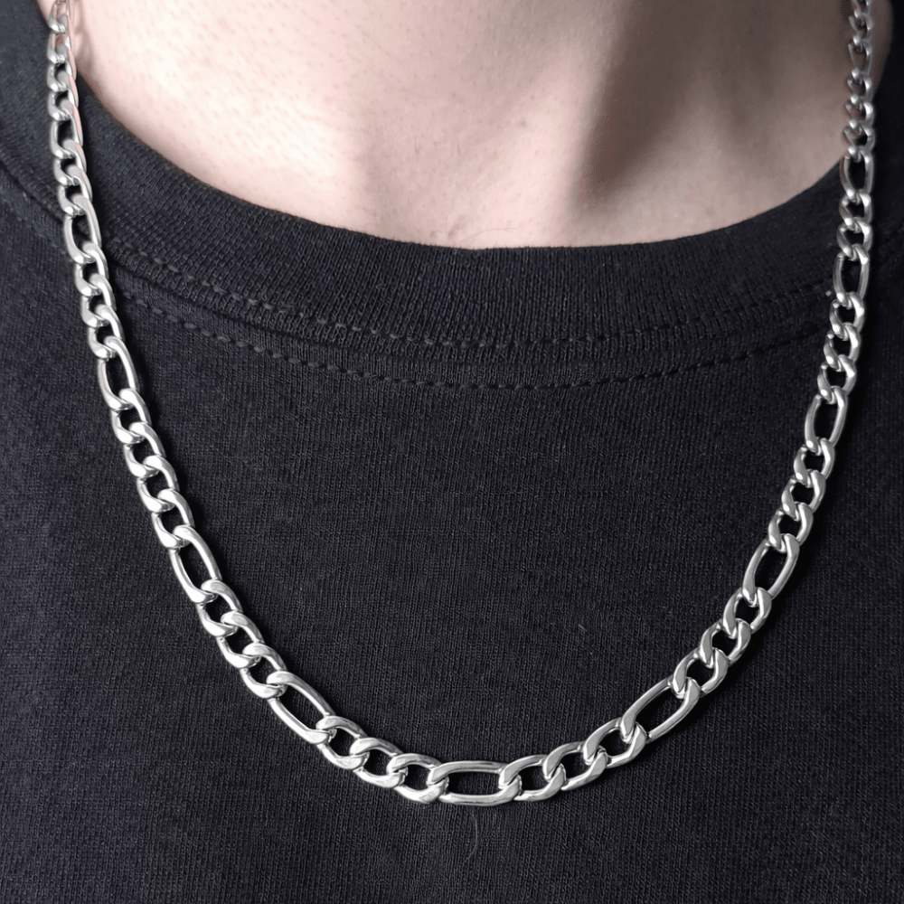 man wearing Figaro Chain silver necklace close-up