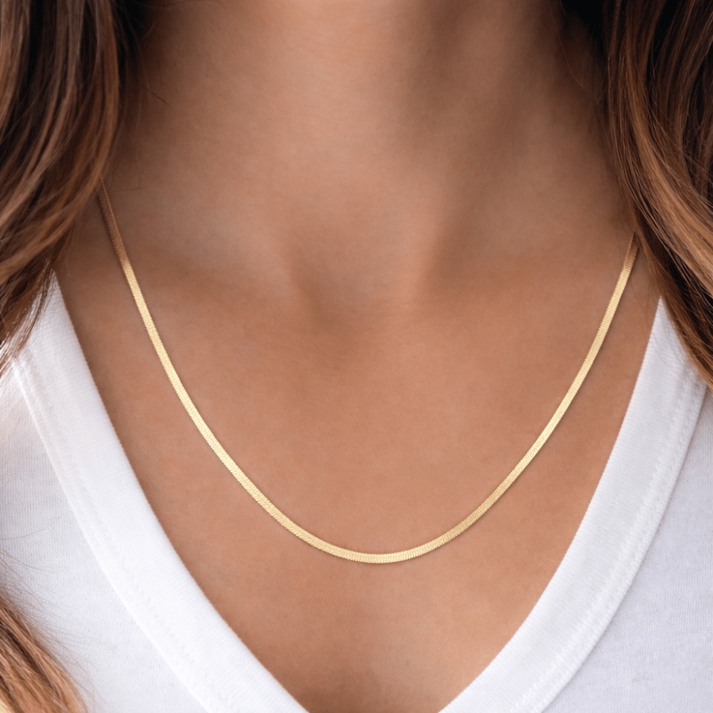 woman wearing Herringbone Necklace gold close-up
