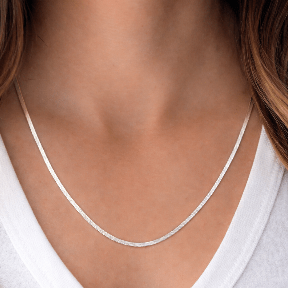 woman wearing silver herringbone necklace everyday styling